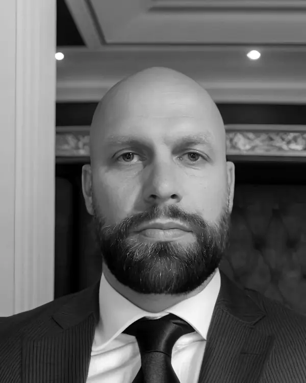Brian Halstead in a pinstripe suit and tie